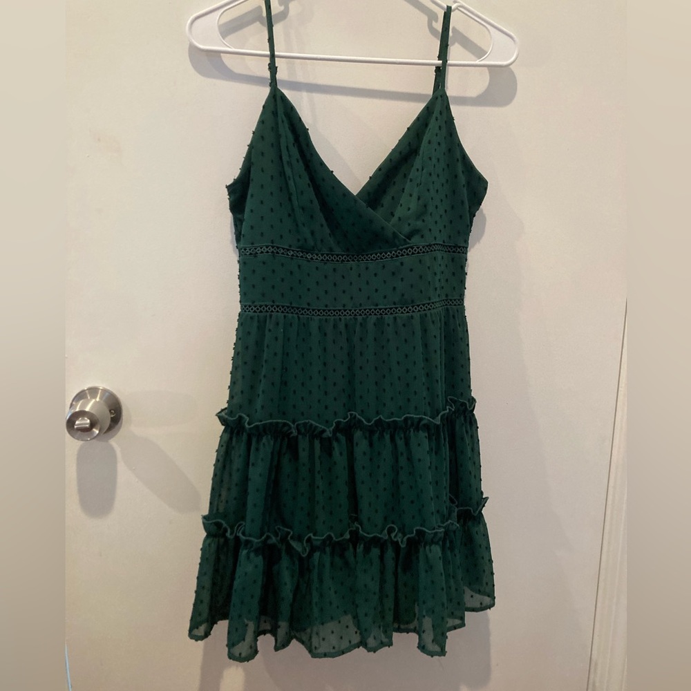 Green Francesca’s V neck dress with black dots